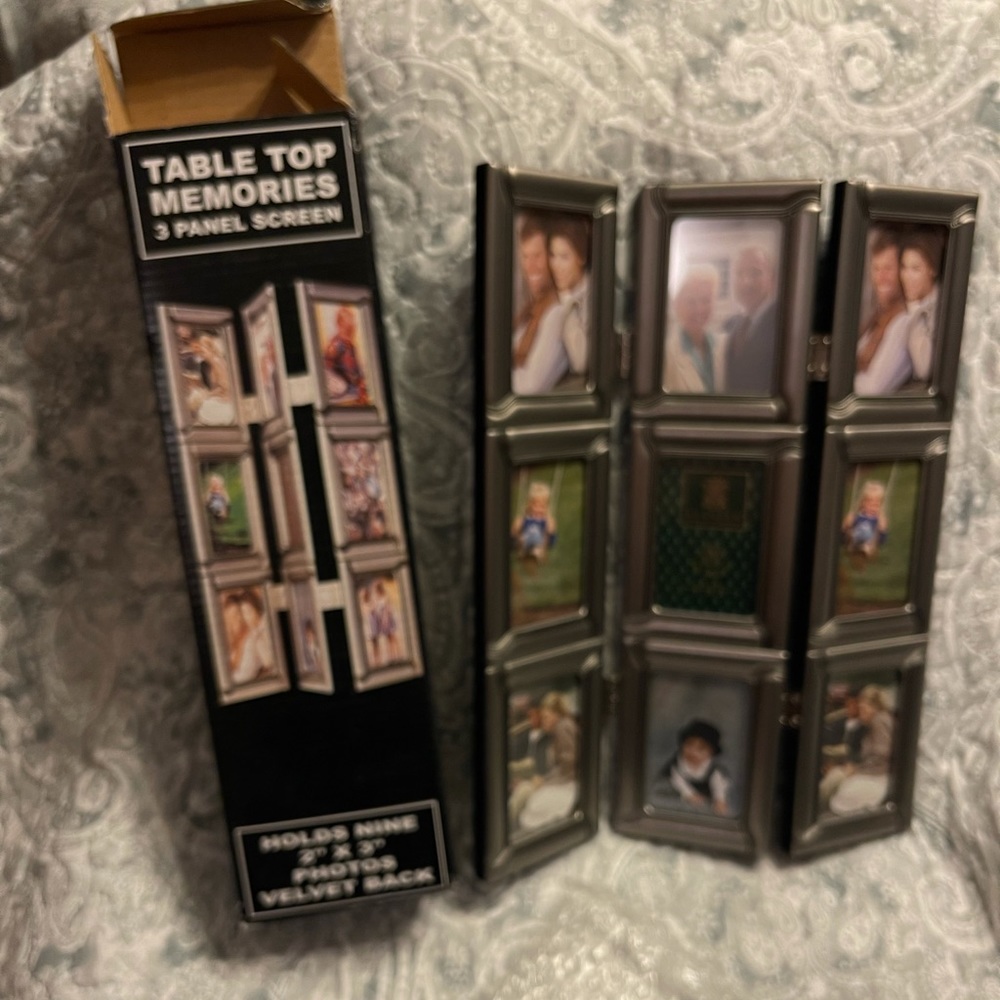 3 panel silver photo screen frame. Holds 9 2x3 photos